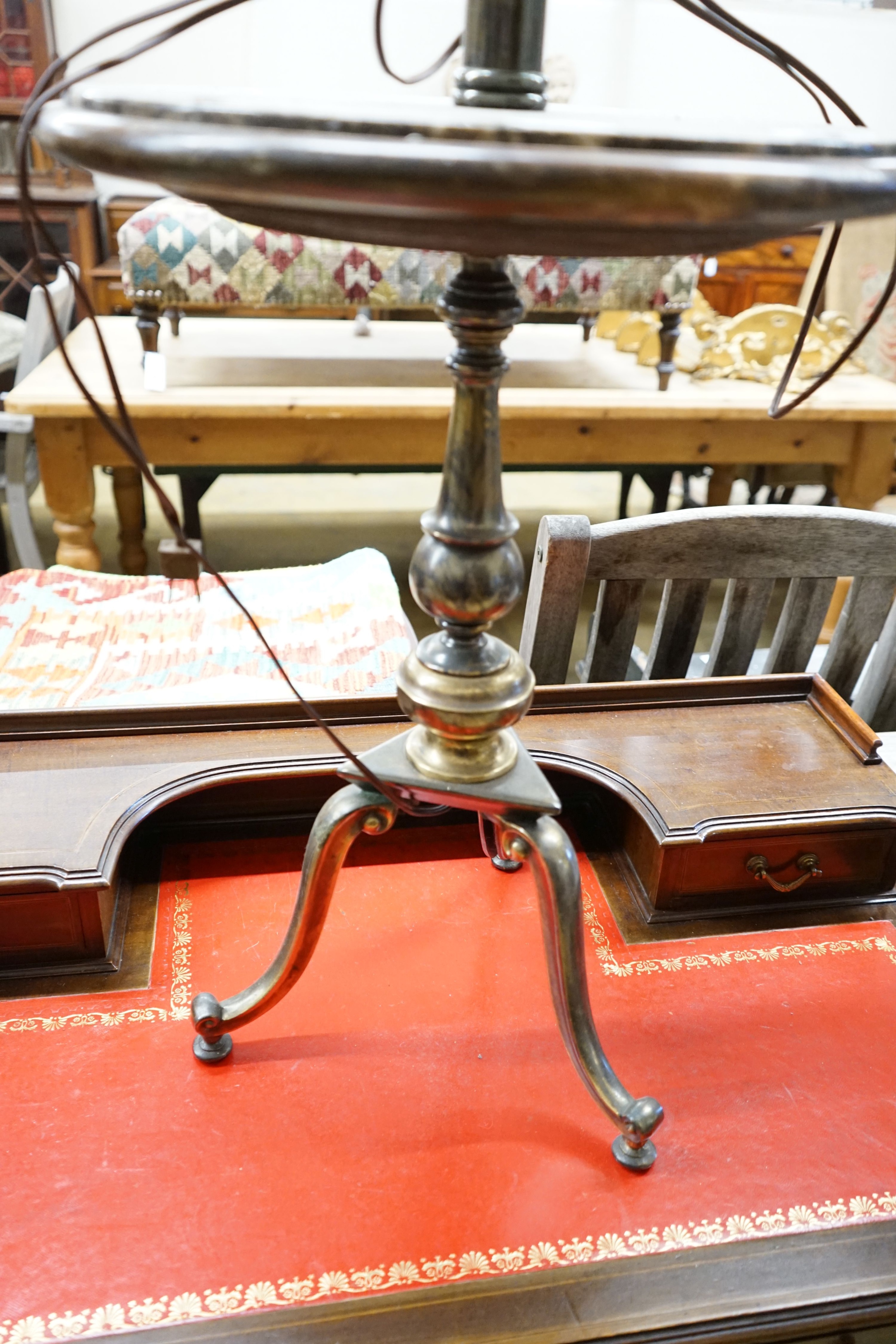 A polished gilt metal and marble tripod floor lamp, height 110cm